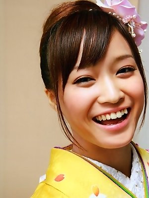 Beautiful gravure idol dressed in a bright and colorful kimono